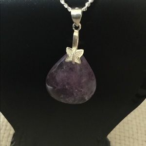 9.25 Sterling silver necklace with purple gem
